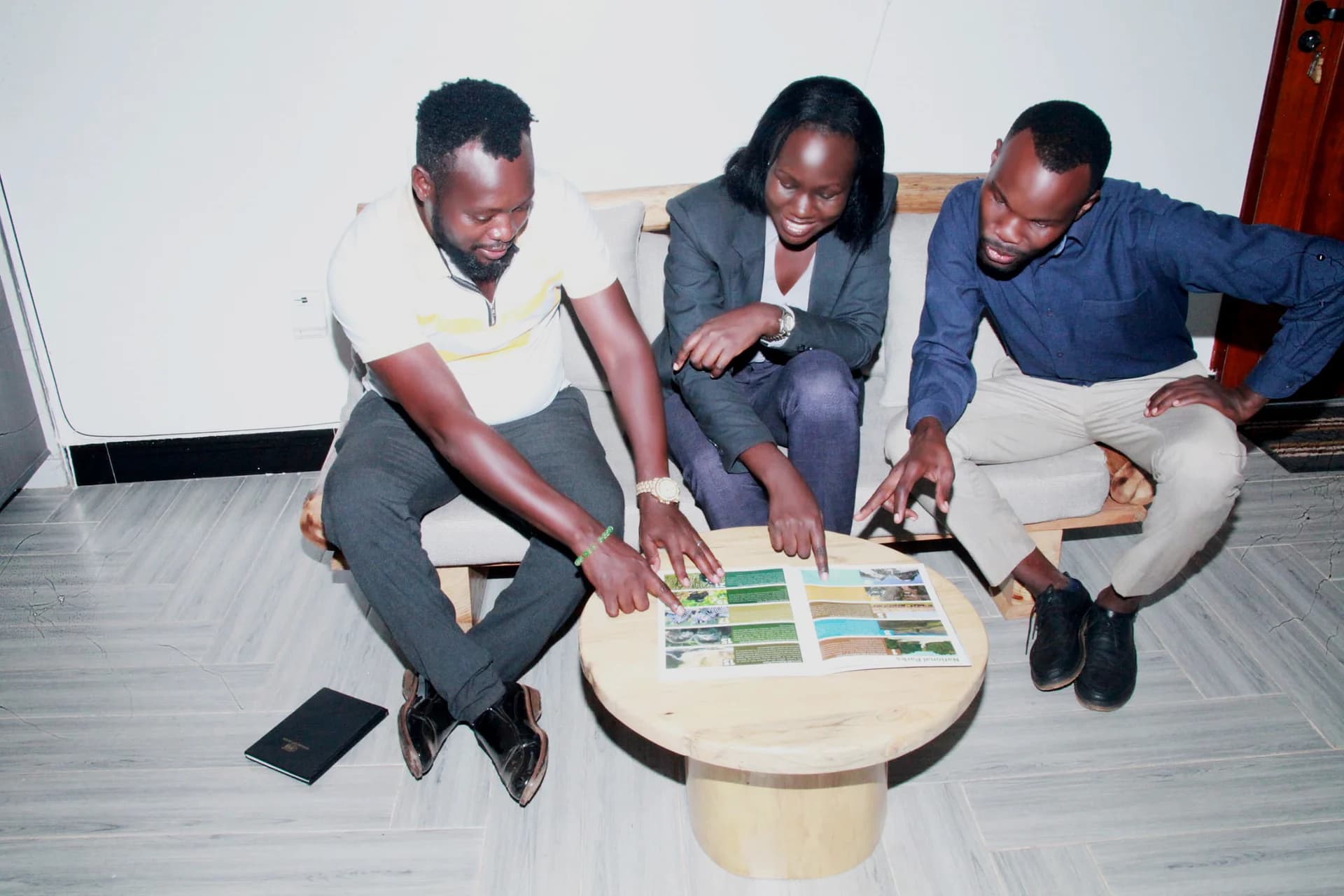 Ambasa Tours team reviewing travel materials